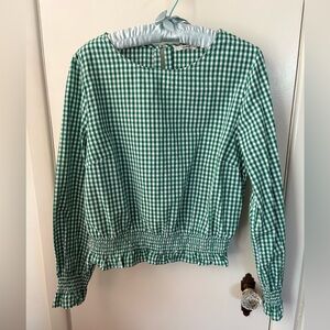 Gingham green blouse with smocking at waist and wrists.